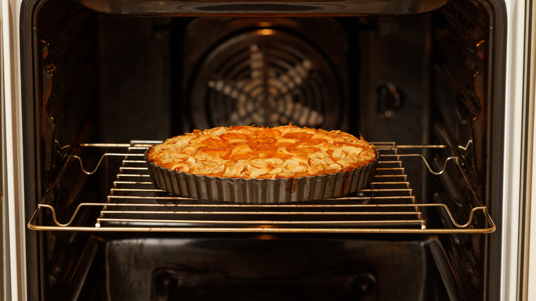 close up of pie baking in oven