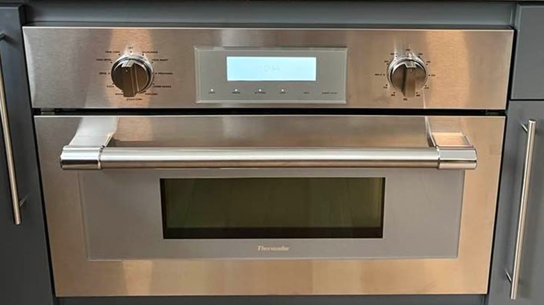 A speed oven built into kitchen cabinetry.