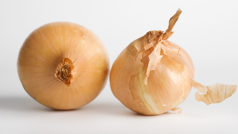 Two whole yellow onions