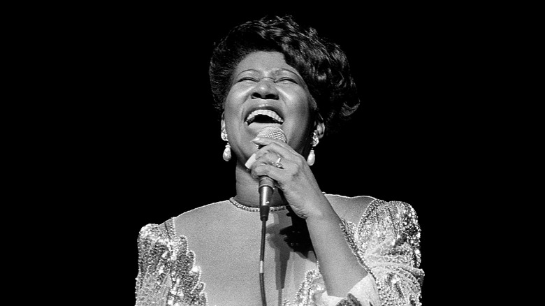 Black and white photo of Aretha Franklin singing