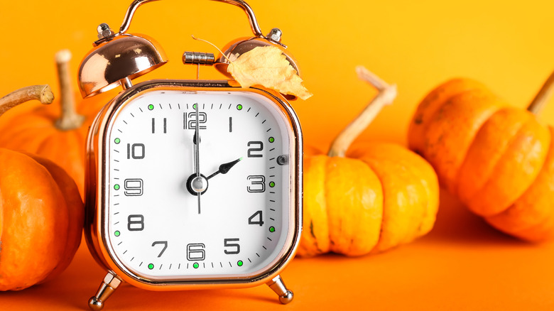 Clock and pumpkins