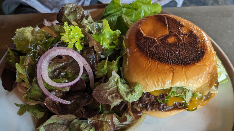 Burial Beer smashburger with salad