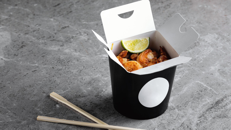 Chinese takeout box with chopsticks