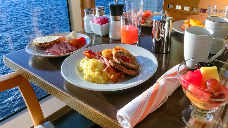 Cruise ship breakfast foods on a table overlooking the ocean