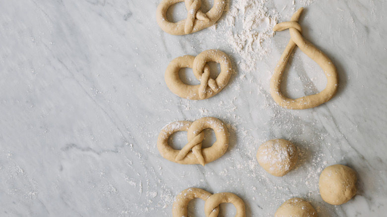 Flour dusted over pretzel dough