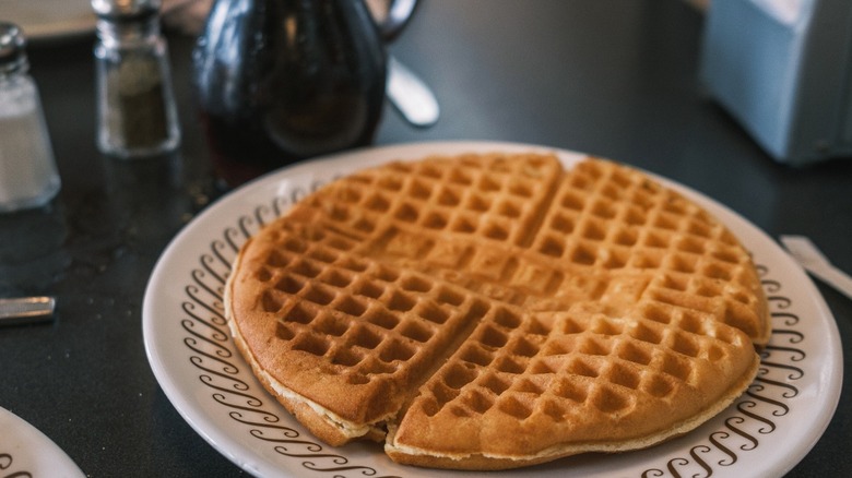 A breakfast featuring waffles and coffee at Waffle House.