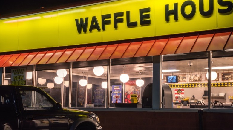 The exterior of a Waffle House after dark.