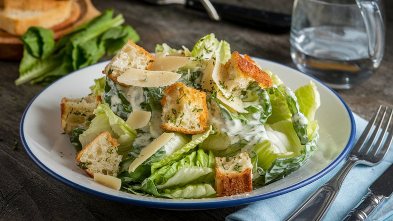 A Cesaer salad on a white plate