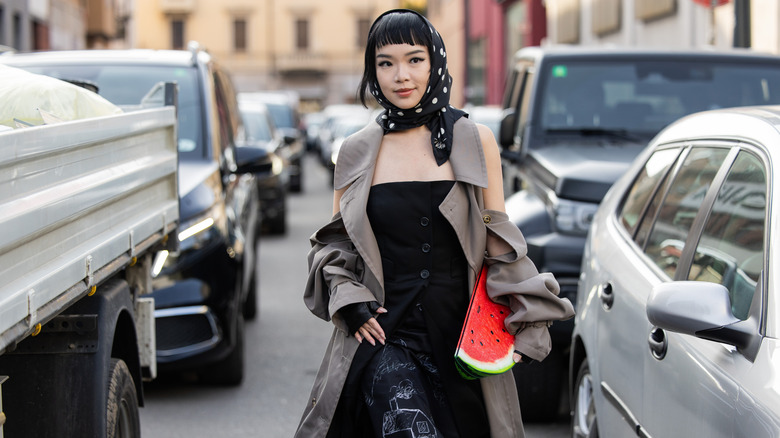 Street fashion featuring a watermelon-shaped clutch