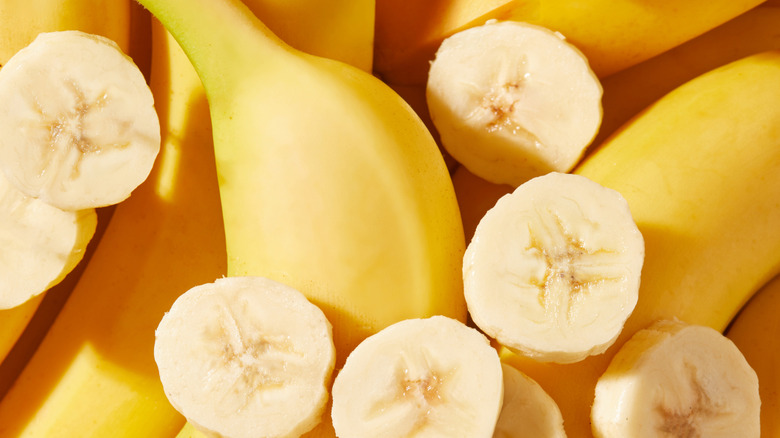 Close-up of sliced and whole bananas