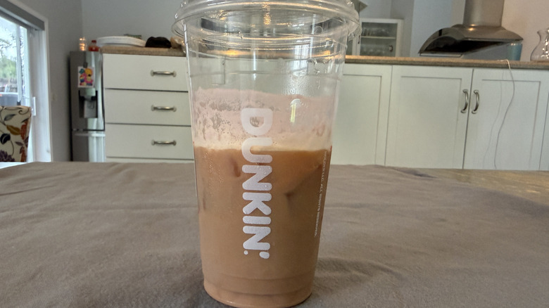 Dunkin' Barbie Almond Strawberry Shortcake Iced Coffee on grey tablecloth