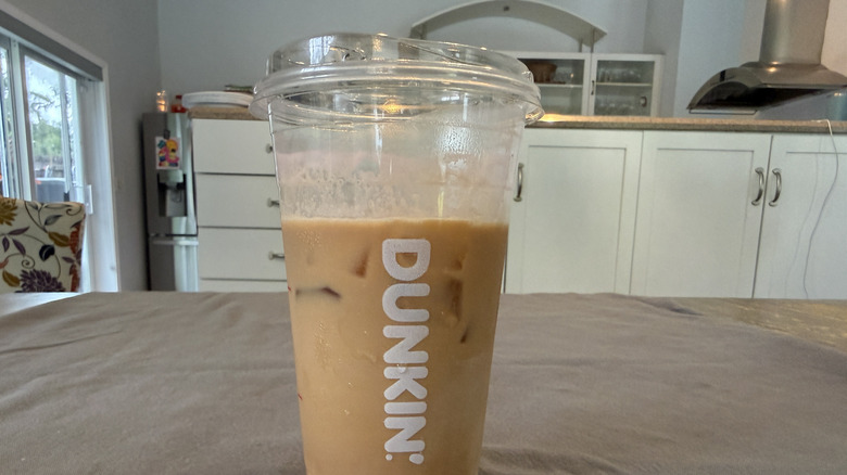 Dunkin' Barbie Drink Missing Strawberry cold foam on grey tablecloth