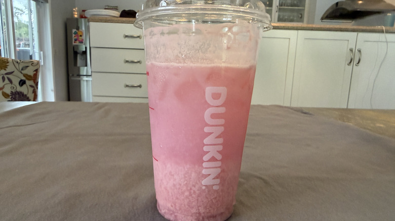 Dunkin' Barbie Ultimate Pink Daydream Refresher on grey tablecloth