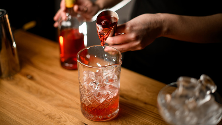 bartender pouring alcohol