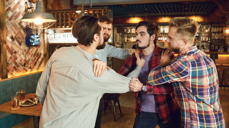 men fighting in bar