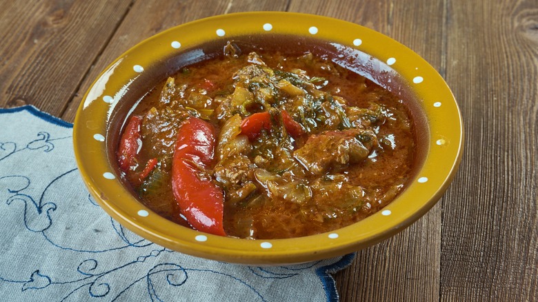 Basque lamb stew in a decorative orange-hued bowl
