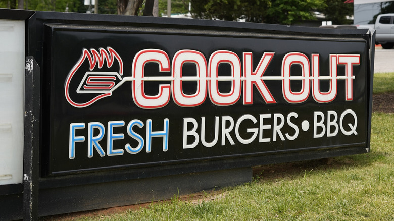 Cook Out logo display on grass