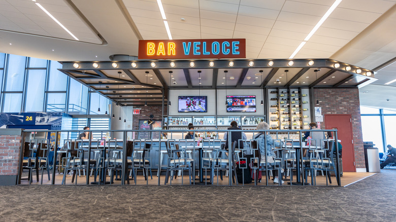 Customers ordering at Bar Veloce inside LaGuardia Airport