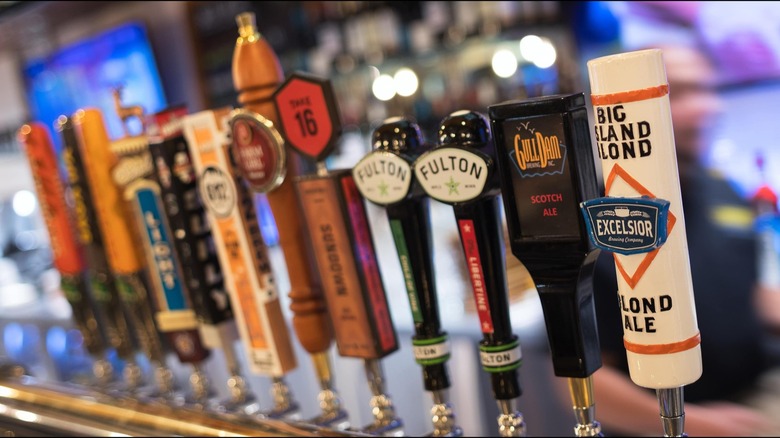 A row of beer tap handles