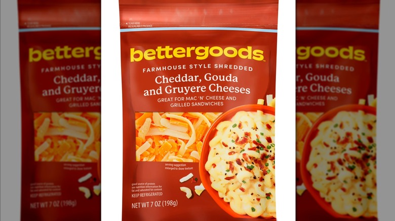 Bettergoods Farmhouse Style Shredded Cheddar, Gouda, and Gruyere Cheese in front of white background