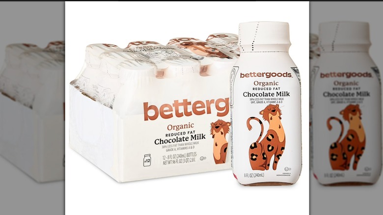 Bettergoods Organic Reduced-Fat Chocolate Milk case with bottle placed in front with cartoon on package