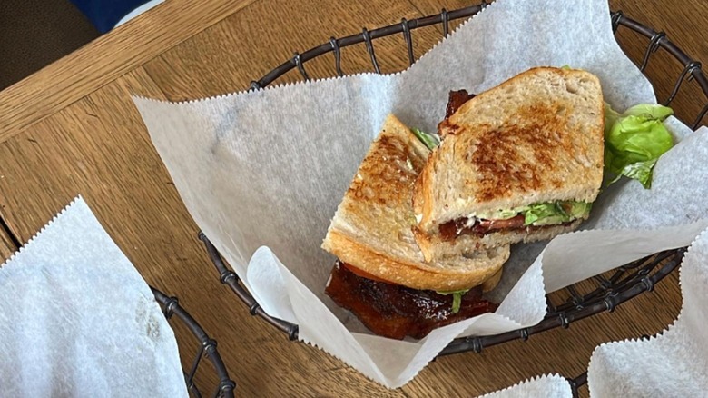 Joe's Butcher Shop BLT in a basket with paper lining