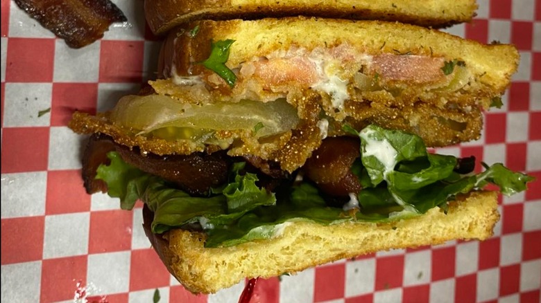 The Tomato Place Fried Green Tomato BLT on red checkered paper