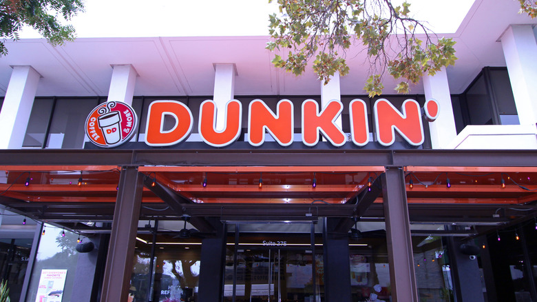 Dunkin' cafe exterior in building with steel girders