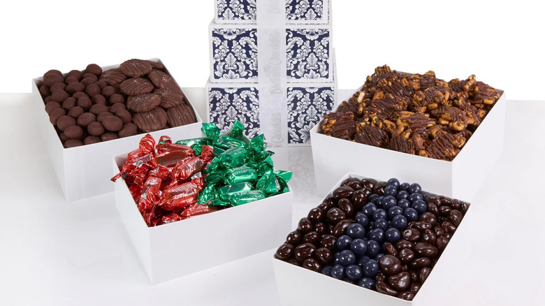 four boxes full of a variety of chocolates