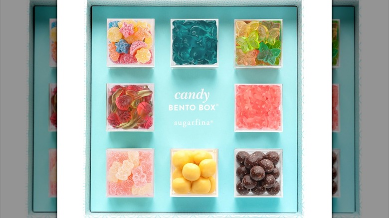 square box with eight cubes of colorful candy