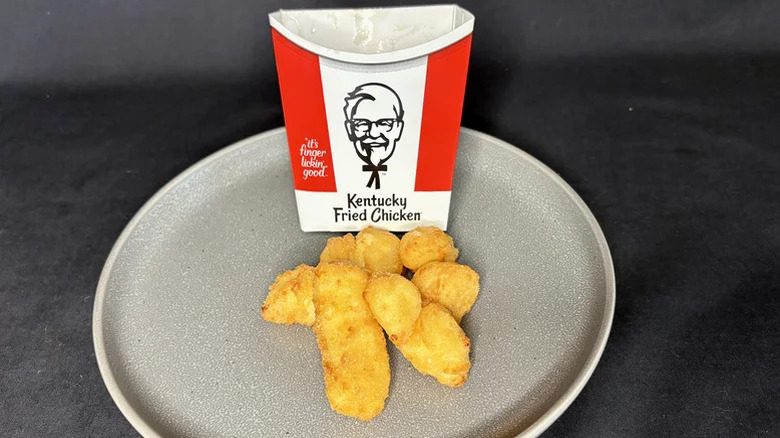 KFC cheese curds in a paper carton