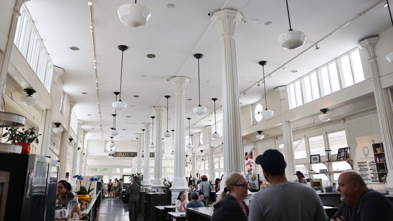 People gather in an upscale renovated market in the historic St. Roch neighborhood in New Orleans, LA