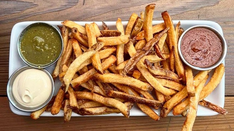 Platter of French Fries or Frites with dippings for sides from Leon's Full Service