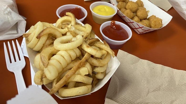 Kurly Q. Fries from The Pad in a container