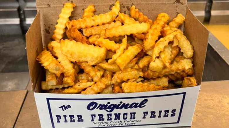 To go box of crinkle cut French fries from Pier French Fries