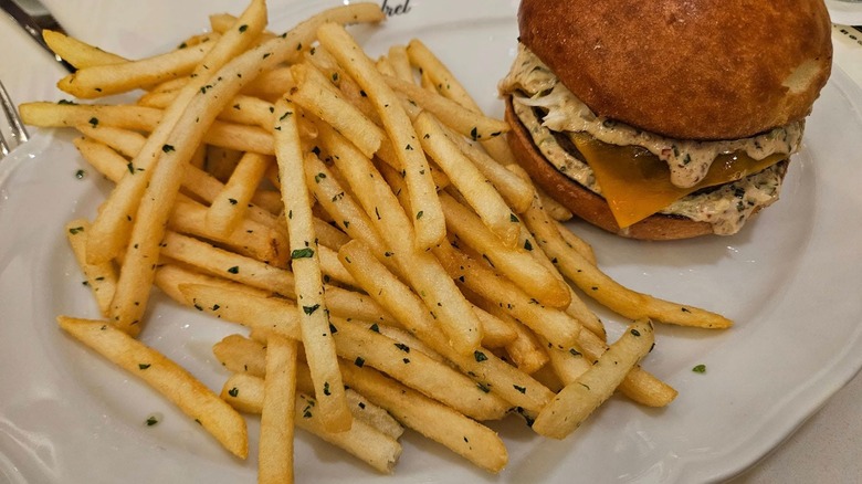 Duck fat fries beside a burger from Scoundrel