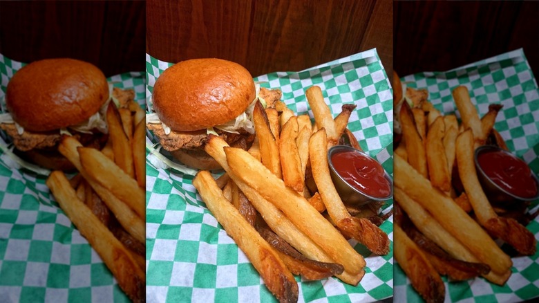 French fries with a burger and a side of ketchup from Bait Shop