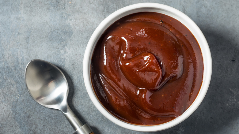 Top view of a small white bowl of barbecue sauce