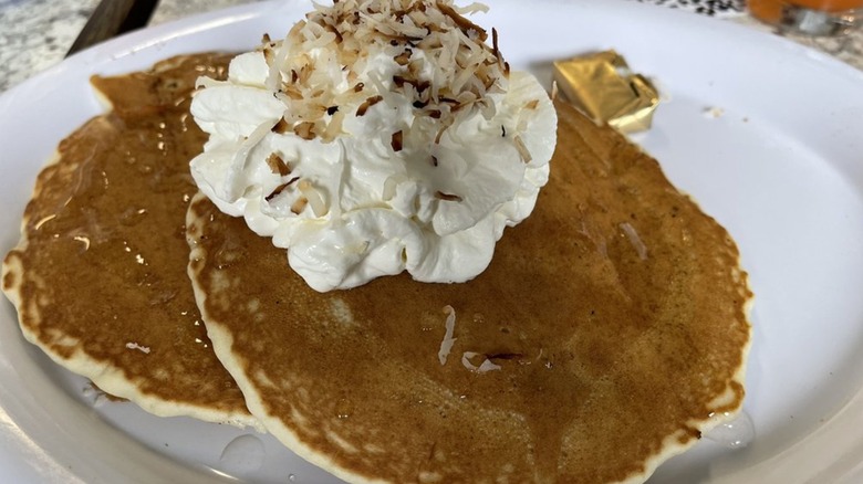Banana and Macadamia pancakes topped with coconut syrup at The Stilly Diner