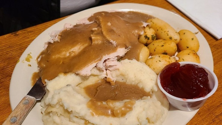 Turkey, mashed potatoes, roasted potatoes and cranberry sauce at My Mother's Restaurant