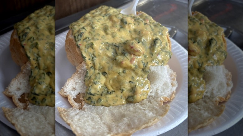 Crawfish and Spinach Bread Bowl on paper plate at Bon Creole restaurant
