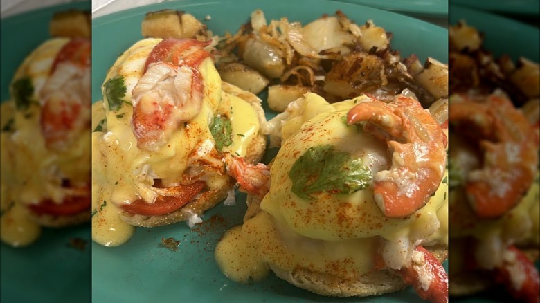 Lobster Benedict with roasted potatoes on plate at Deb's Bristol Diner