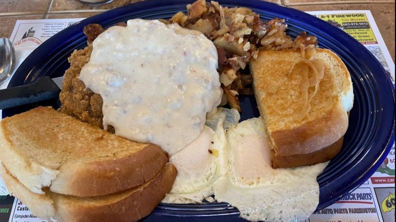 Country fried steak and eggs with onion home fries and sourdough toast at The Farmer's Kitchen