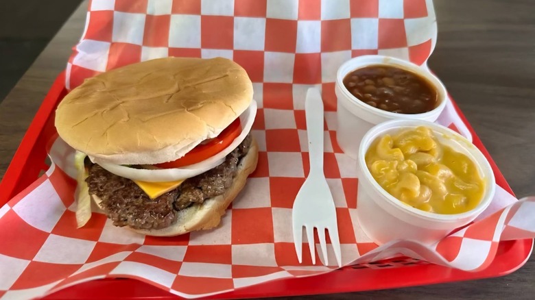 Burger with sides of beans and mac and cheese at Mac Smith's Country Store and Grill