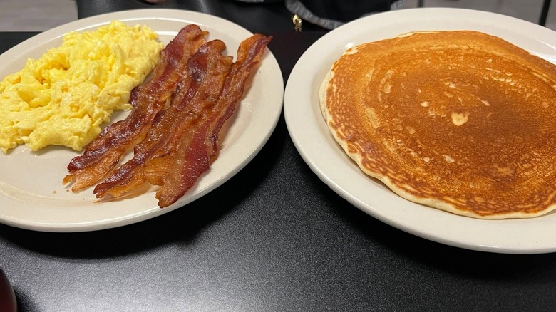 Pancake with eggs and bacon at West Side Cafe