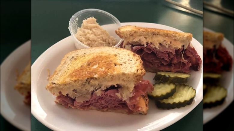 Reuben with side of pickles at The Cavalier Store