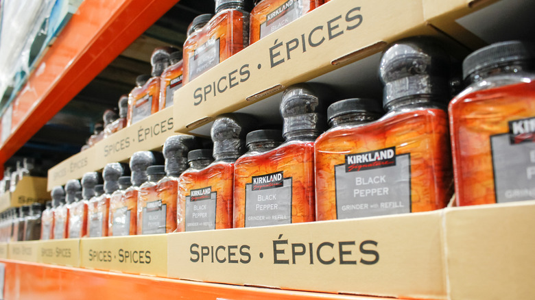 Packaged jars of black pepper on a shelf at Costco