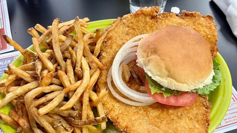 Nick's Kitchen Pork Tenderloin Sandwich with side of fries