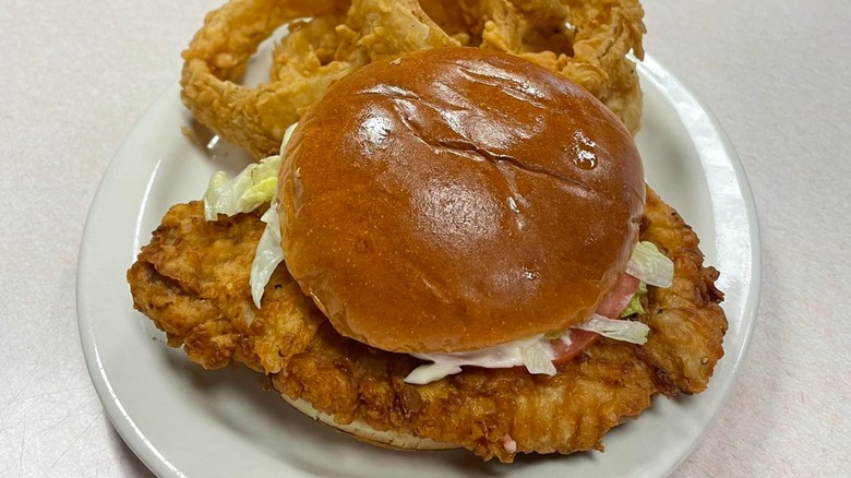 Steer-In Pork Tenderloin Sandwich with side of onion rings