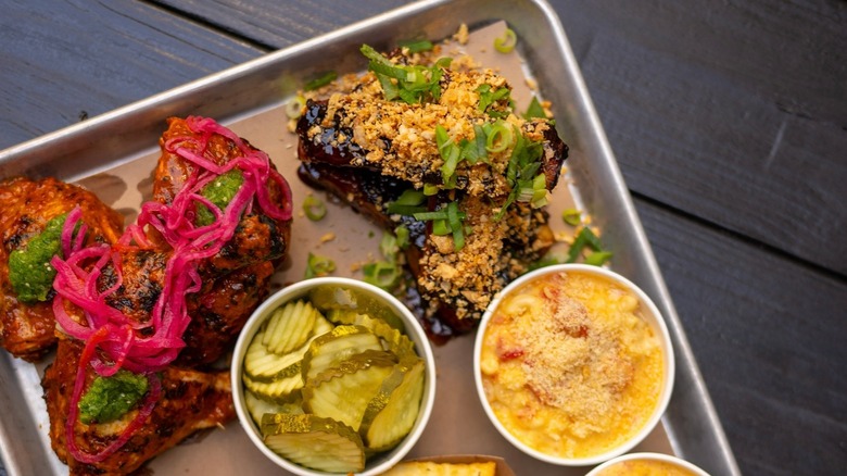 BBQ plate with pickles and macaroni and cheese